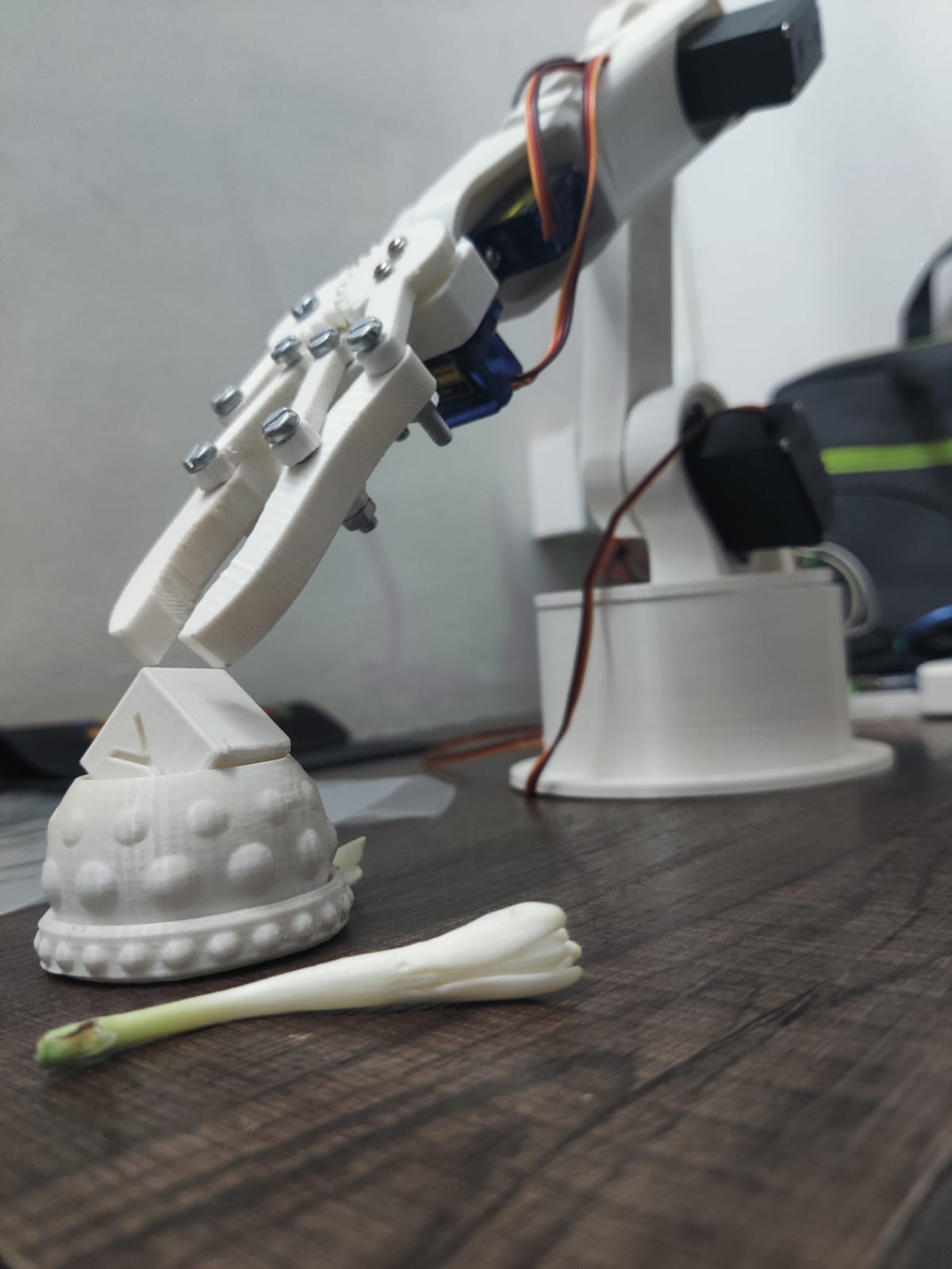 A 3D-printed robotic arm connected to a mobile phone app
