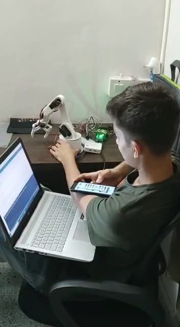 A 3D-printed robotic arm connected to a mobile phone app
